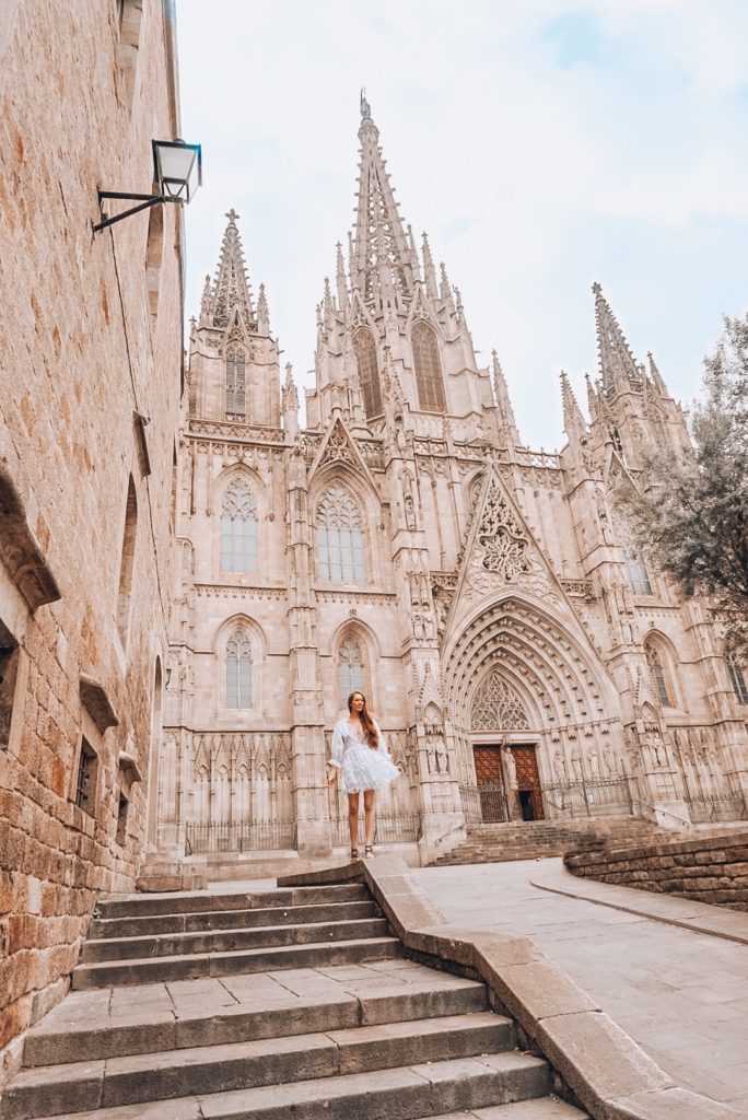 woman standing in front of the Cathedral of Barcelona