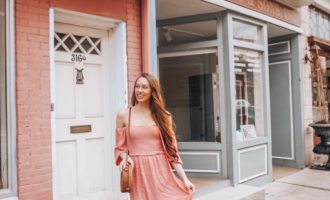 Girl with pink dress discussing creativity.